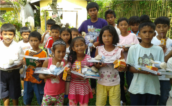 children receiving school supplies